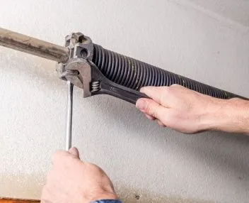 Garage Door Broken Spring Repair by Technician