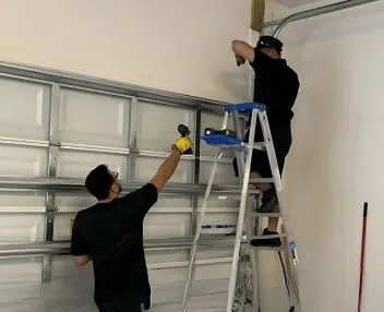 Technician Fixing Stuck or Jammed Garage Doors